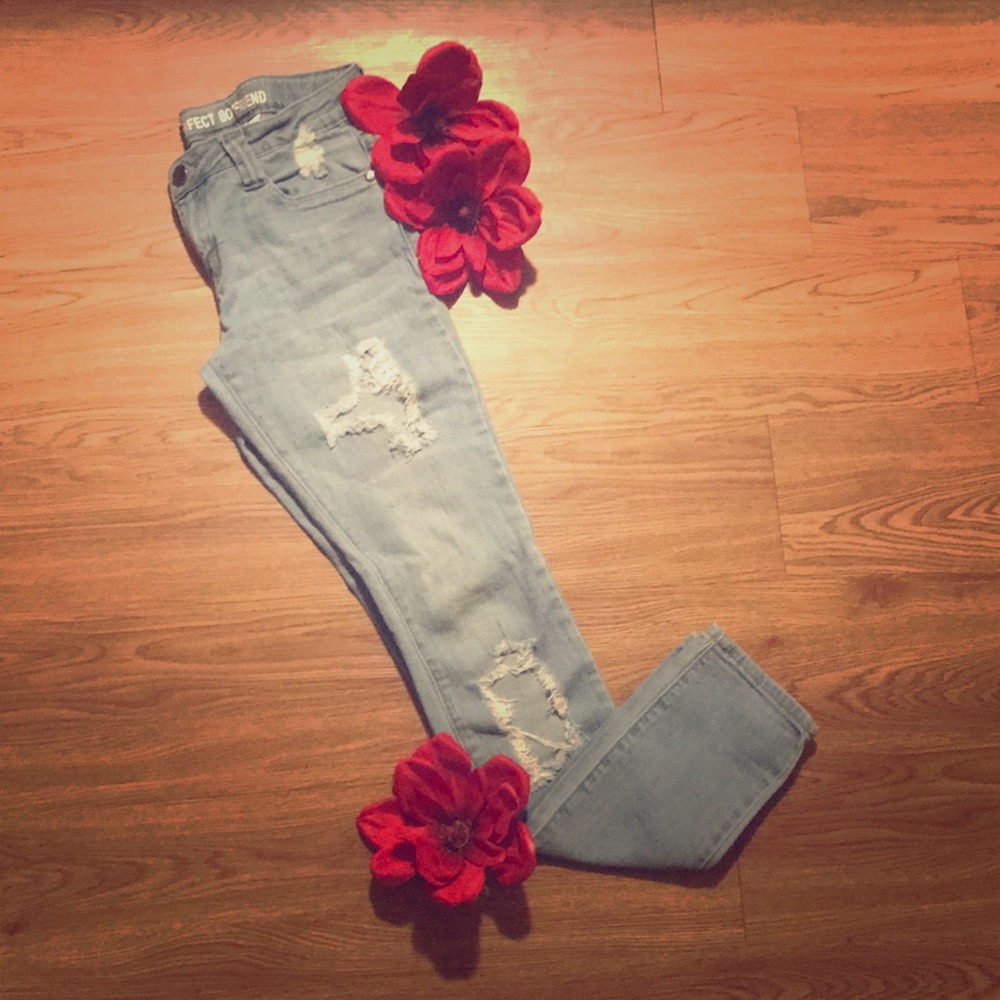 Light blue distressed boyfriend jeans.